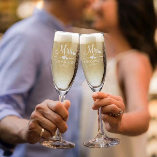 Personalized wedding champagne flutes in a beautiful setting