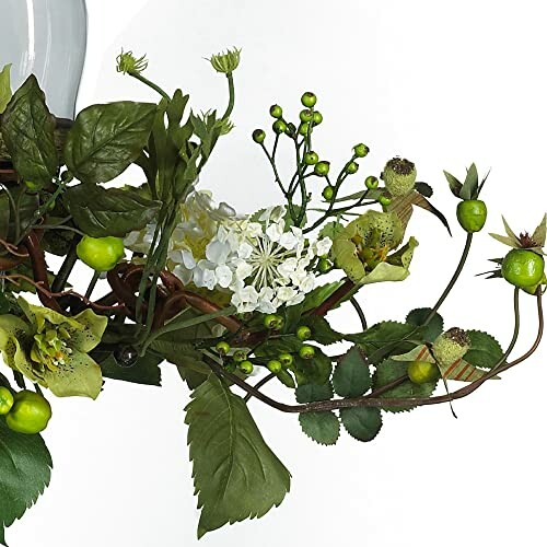 Artificial floral arrangement with green leaves and white flowers.