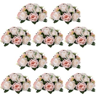 Artificial rose bouquets with pink and white flowers arranged in rows.