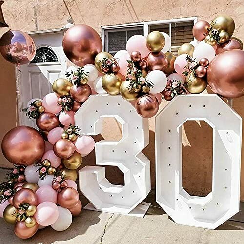 30th birthday balloon decoration with large numbers and colorful balloons