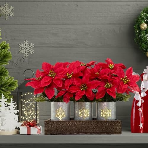 Christmas decorations with red poinsettias and festive ornaments.