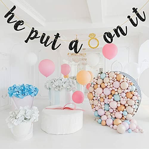 Engagement party decoration with balloons and banner.