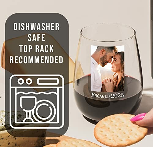 Wine glass with engagement photo and dishwasher instructions.