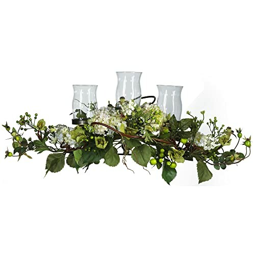 Floral centerpiece with candles and greenery