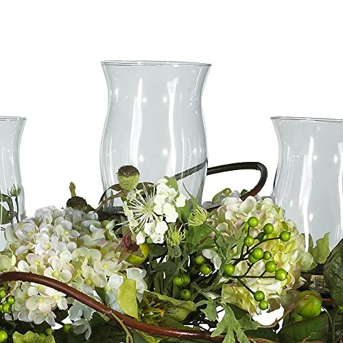 Glass candle holders with floral decoration