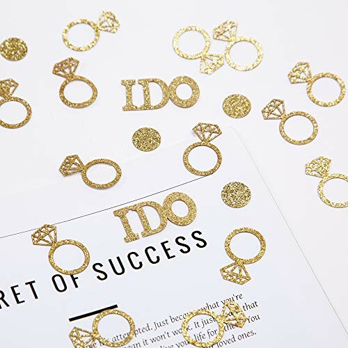 Gold glitter engagement ring and 'IDO' confetti on a paper background, perfect for a wedding party or engagement party decoration.