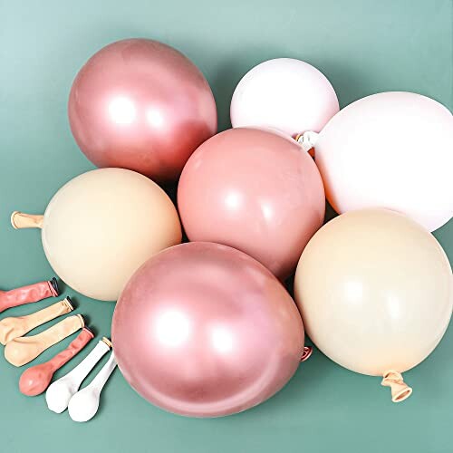 Assorted pastel balloons on a green background.