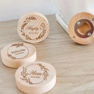 Personalized wooden bottle openers with engraved names and dates.