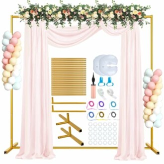 Wedding backdrop stand with drapes, balloons, and floral decorations.