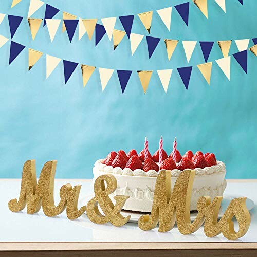 Wedding cake with strawberries and Mr & Mrs sign. Perfect for wedding decorations.